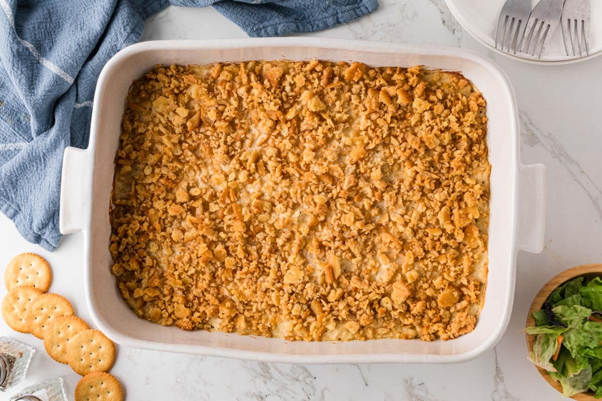 Baked Ritz cracker chicken casserole in a white baking dish.