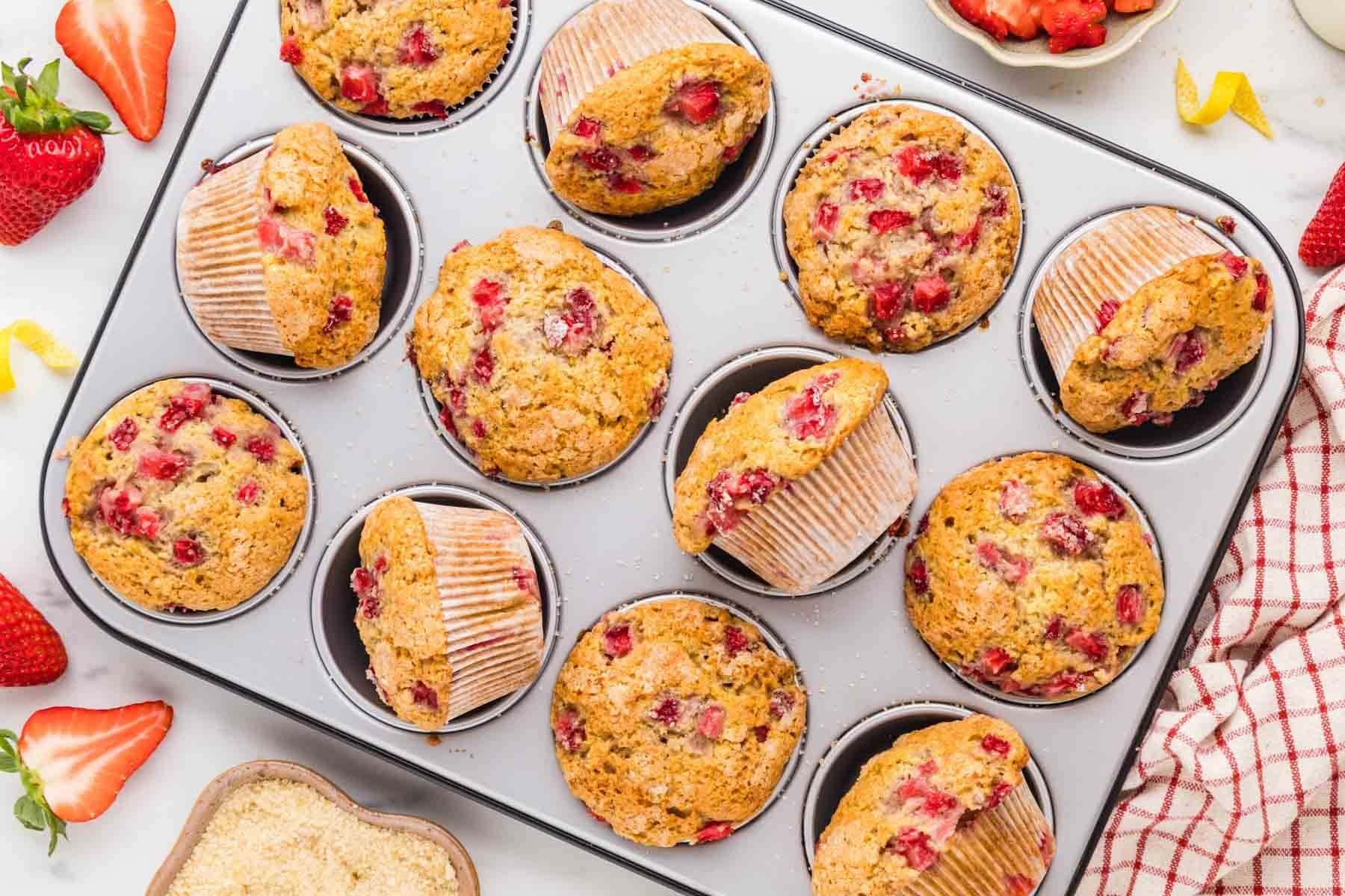 Overhead shot of strawberry muffins in a muffin tin.