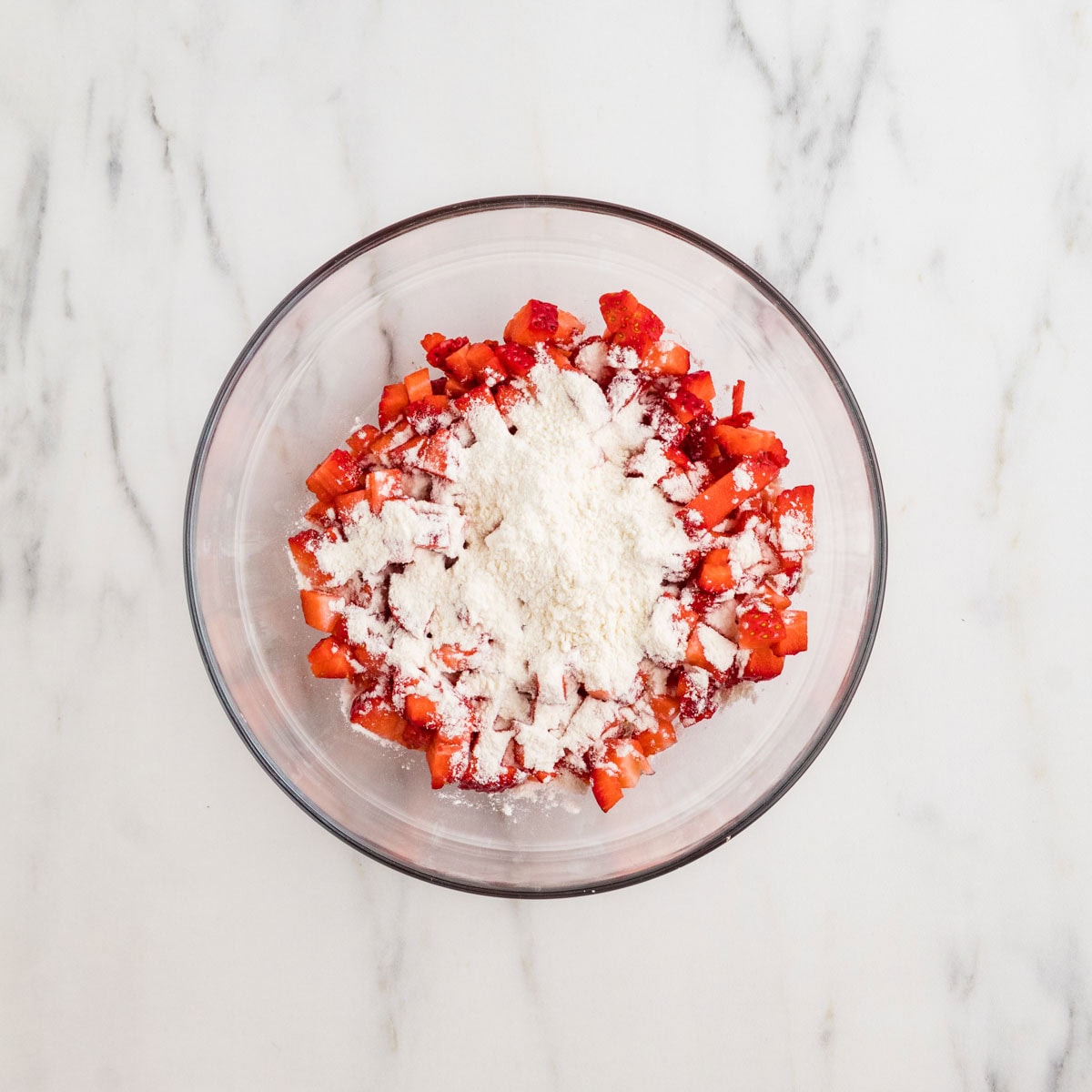 Fresh strawberries with flour in a bowl.