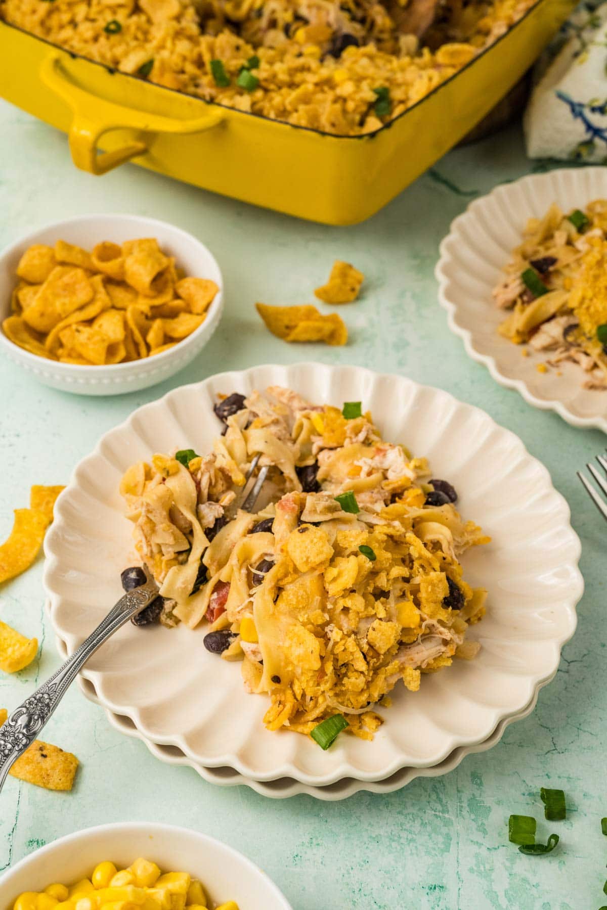Portion of Tex Mex chicken noodle casserole served on a plate.