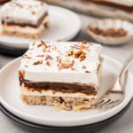 A slice of chocolate delight dessert on a plate.
