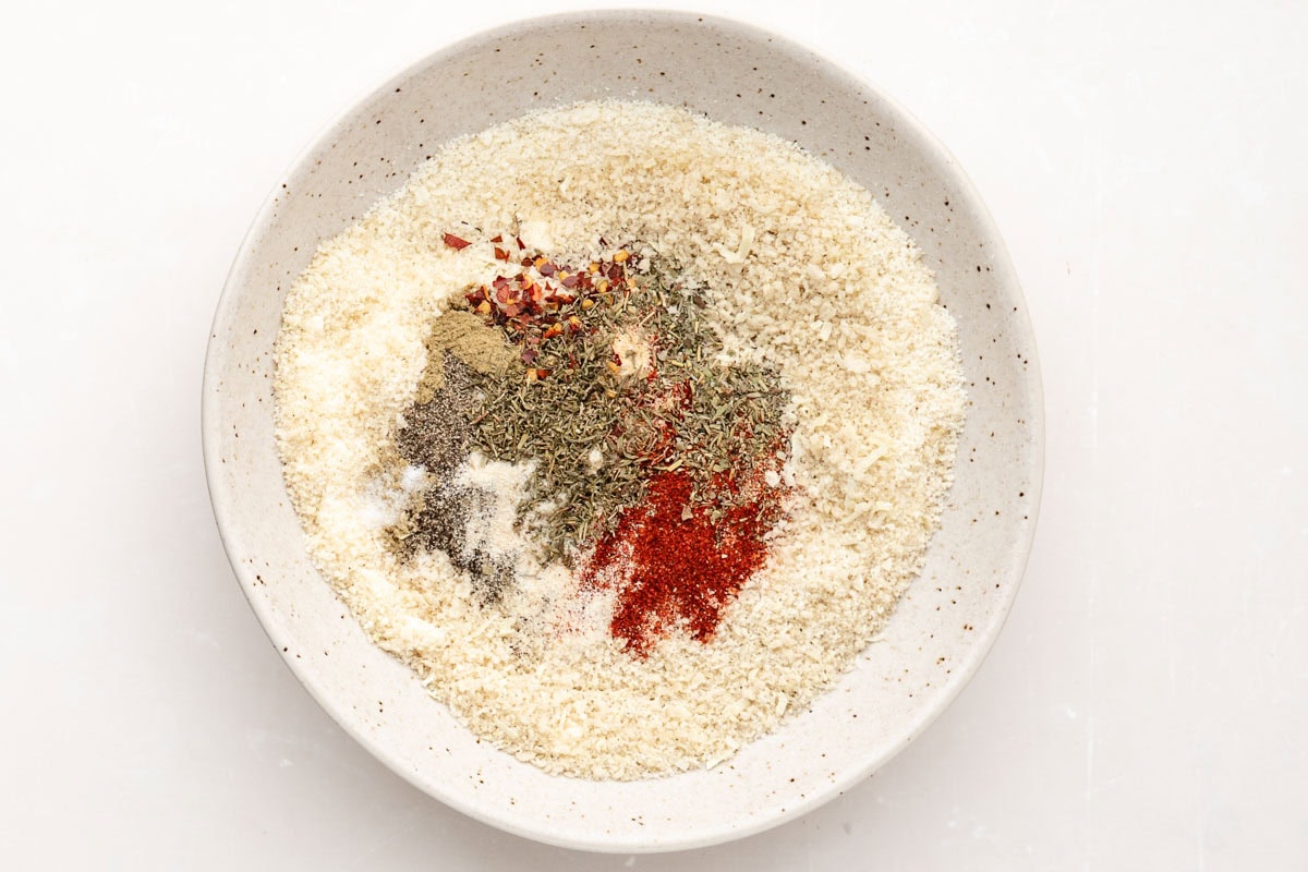 Panko breadcrumbs, parmesan cheese, and spices in a bowl.