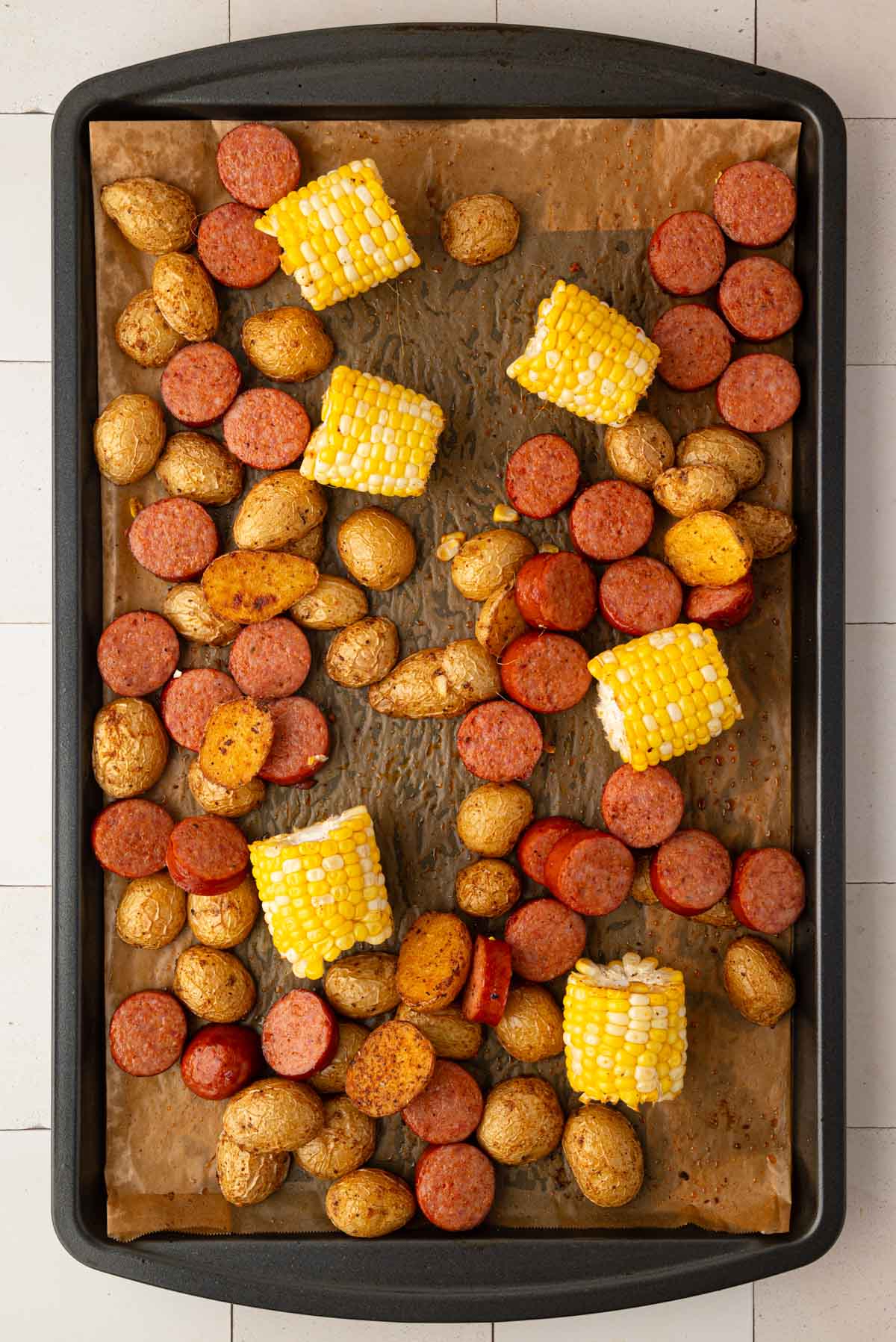 Sausage and corn after being partially baked.
