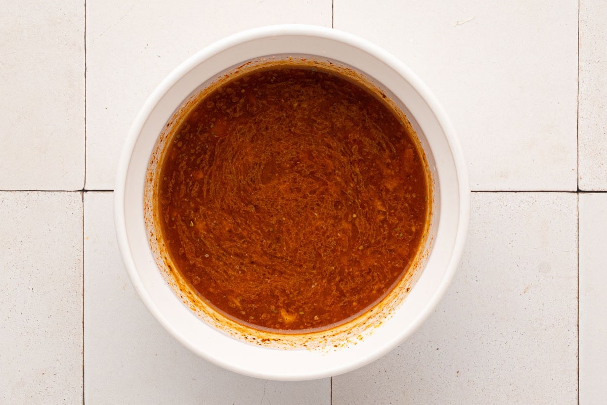 Garlic butter, old bay sauce in a bowl.