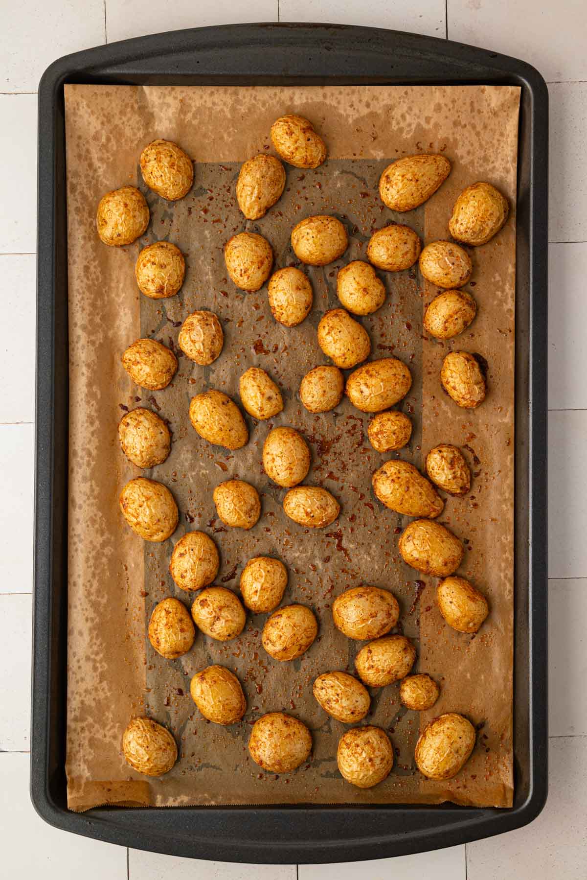 Halved potatoes after being partially baked.