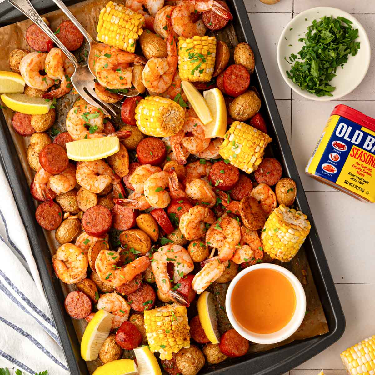 A garlic butter shrimp boil made in a sheet pan.