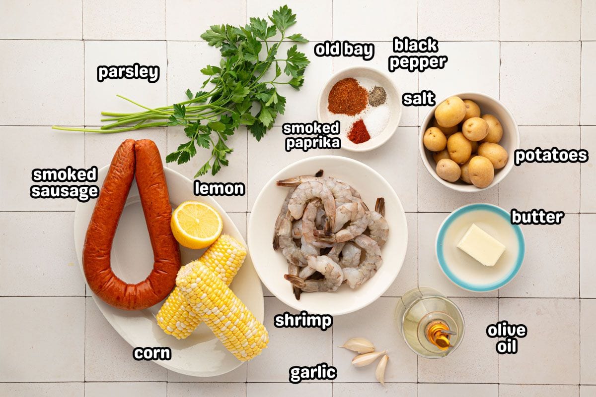 A labeled image of the ingredients needed to make a sheet pan shrimp boil.