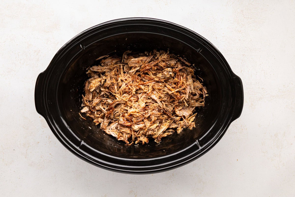 Root beer pulled pork lightly tossed in bbq sauce in the slow cooker.