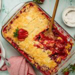Overhead shot of strawberry dump cake in a glass baking dish.
