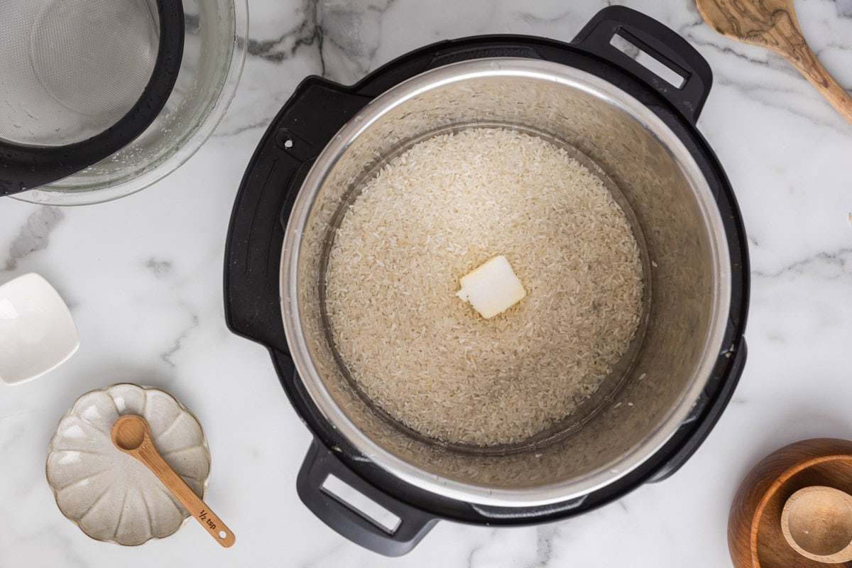 Rice, butter, salt and water added to the instant pot.
