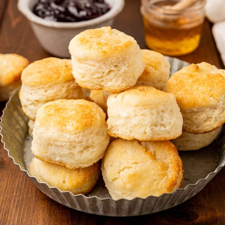 Southern buttermilk biscuits in a tin bread basket.