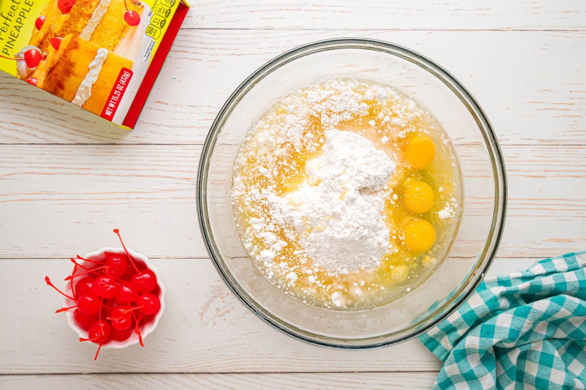 Pineapple cake ingredients in a glass bowl.