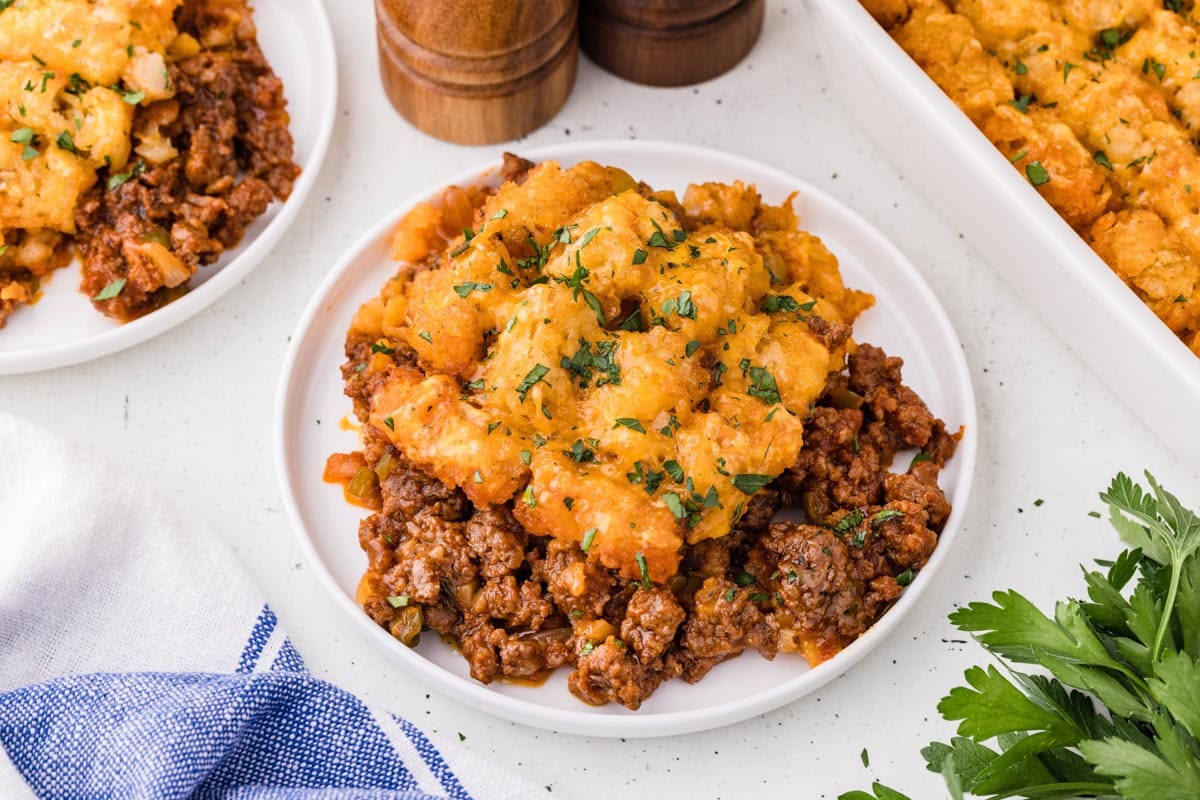 Portion of sloppy joe tater tot casserole served on a plate.