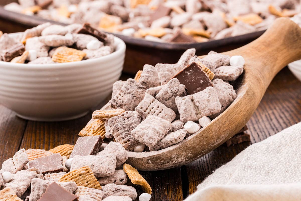 Scoop of s'mores muddy buddies on a table.