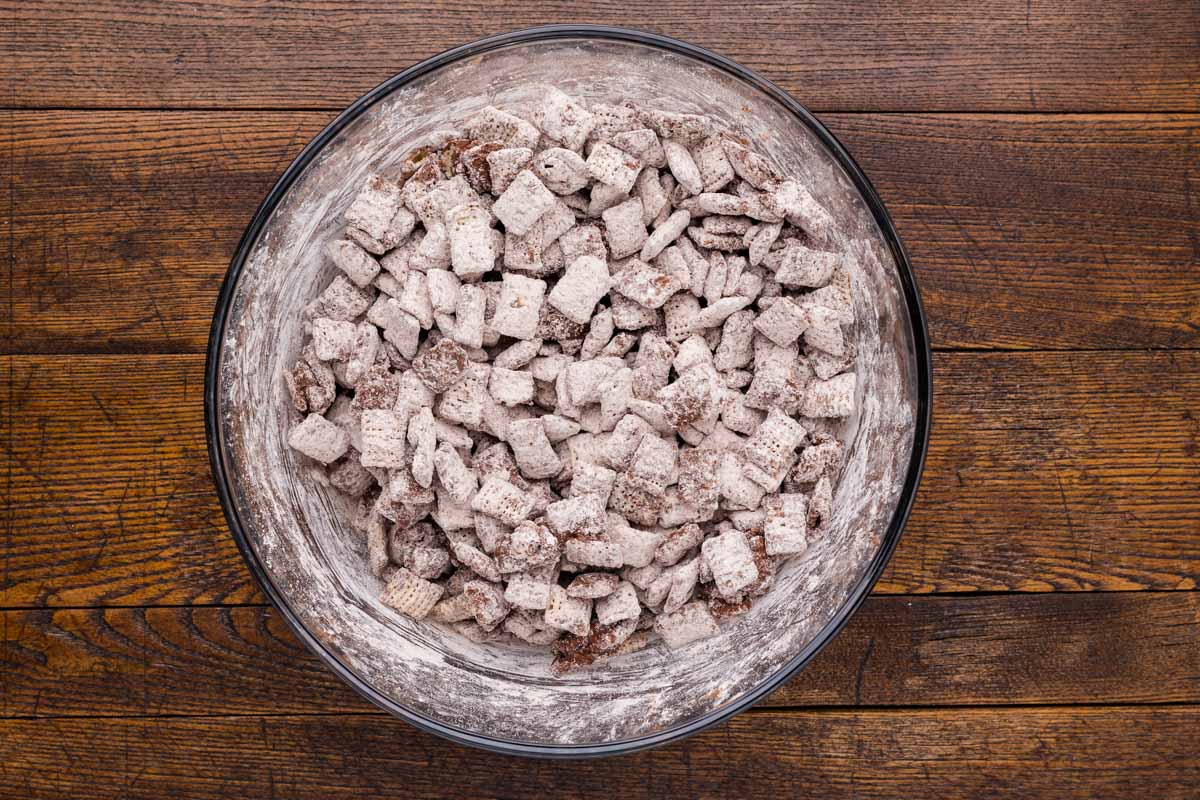 Chex cereal mixed with powdered sugar and cocoa powder mixture.