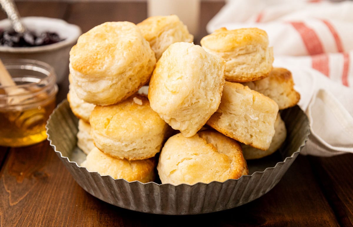Buttermilk biscuits in a tin bread basket.