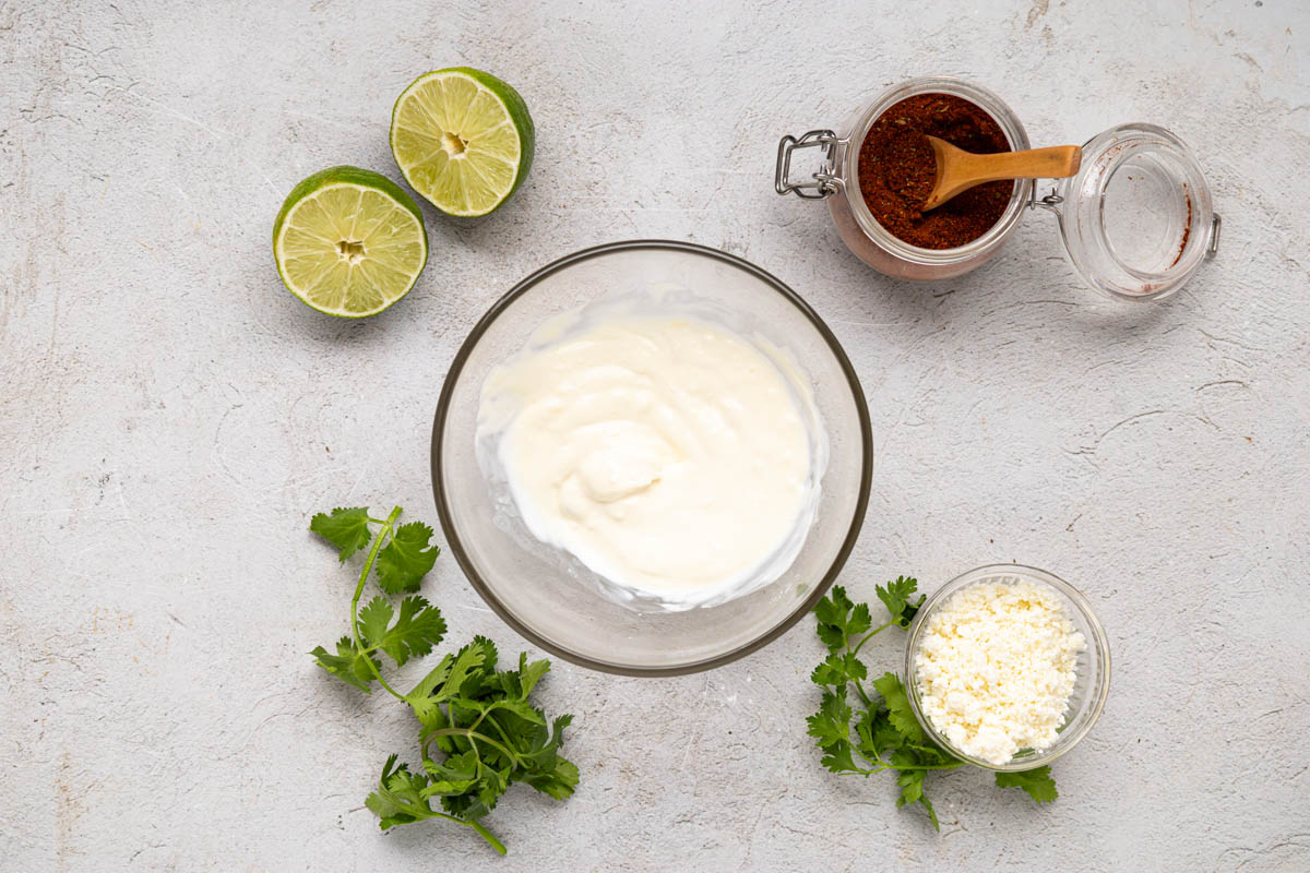 Mayo mixture ingredients stirred together in a bowl.