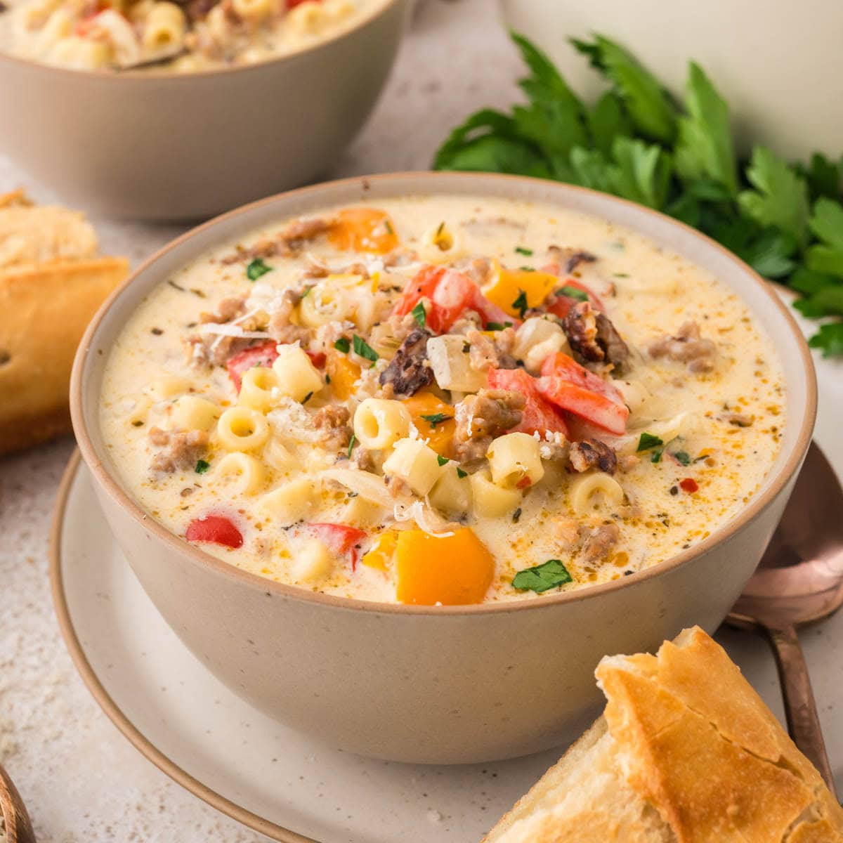 Bowl served with creamy Italian sausage soup.