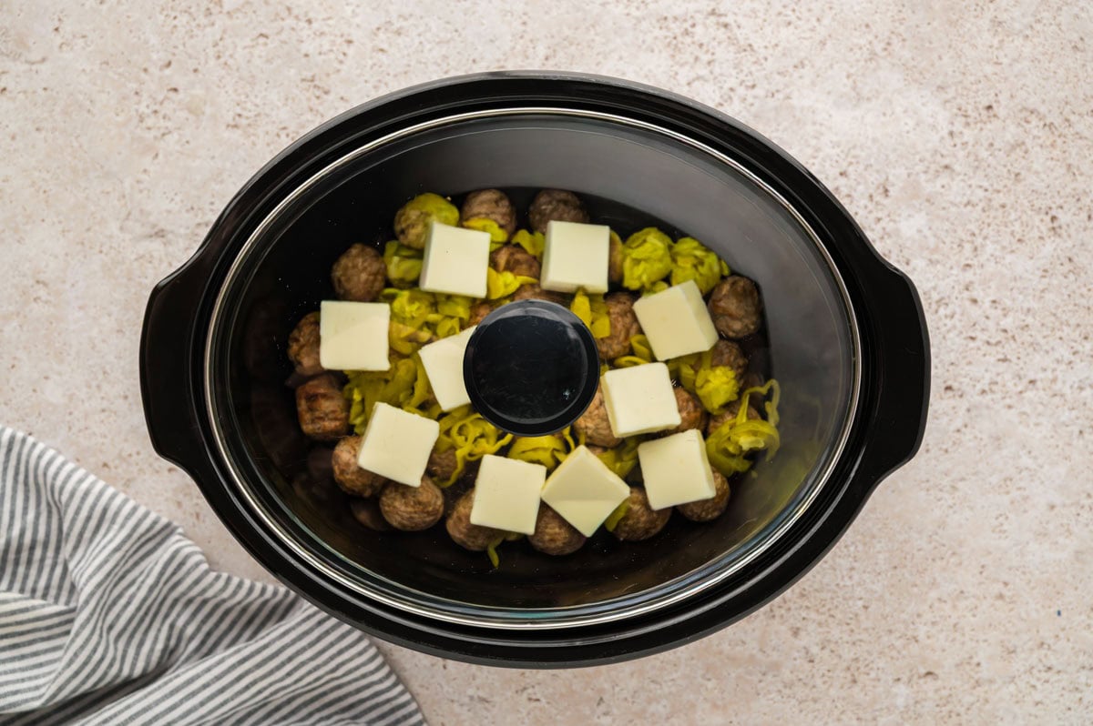Lid placed on top of the crockpot to cook the meatballs.