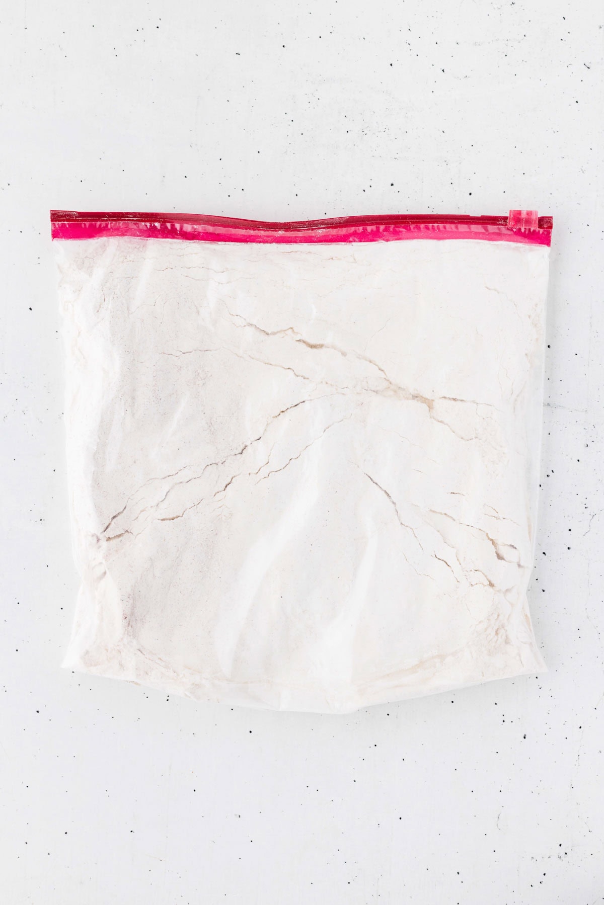 Chicken tender breading mixture combined in a ziplock bag.