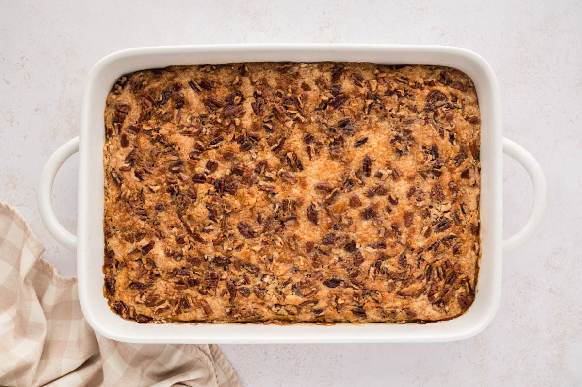 The pumpkin dump cake after being baked in a white 9 X 13 baking dish.