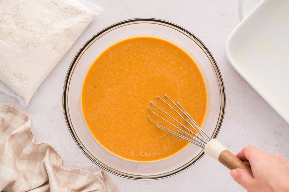 A bowl with whisked pumpkin custard.