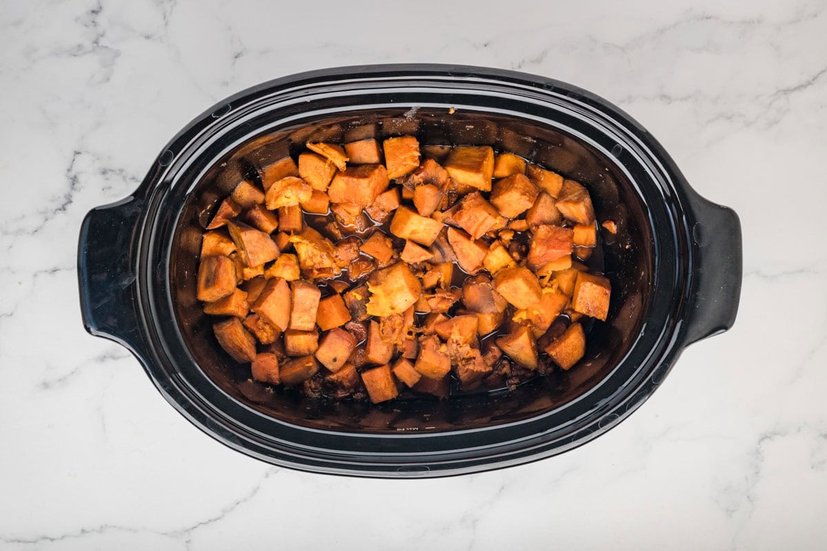 Cooked sweet potatoes in a slow cooker.