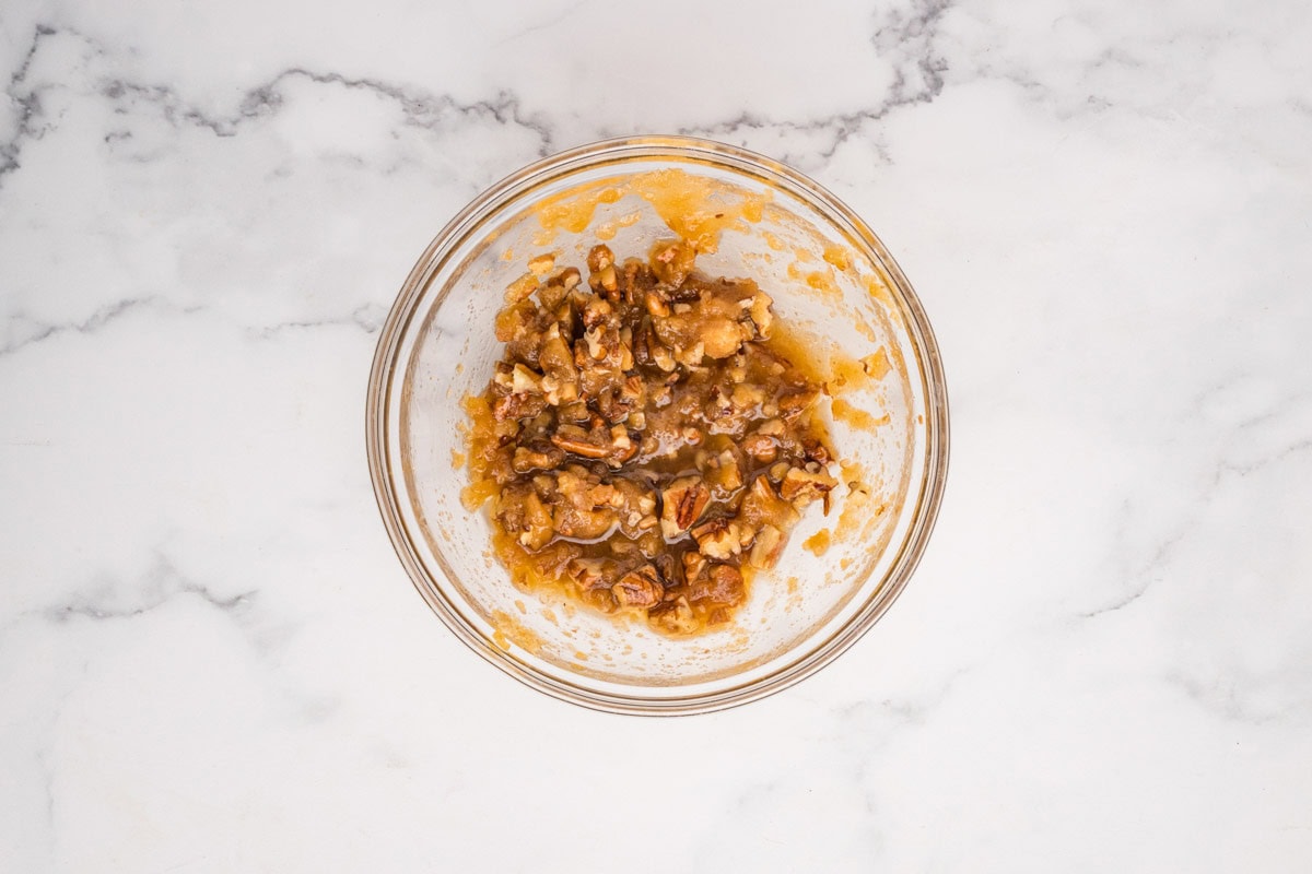 Pecan topping mixture in a small bowl.