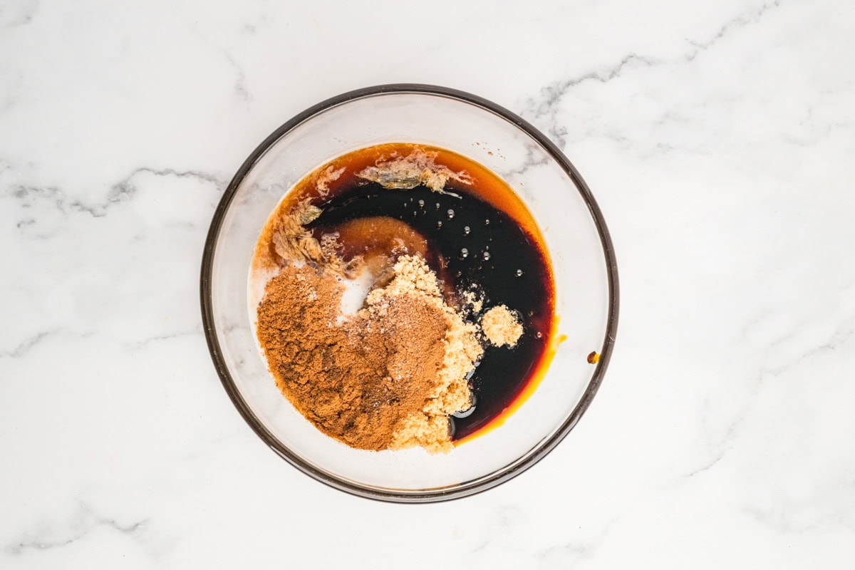 Brown sugar, butter, molasses, milk, spices, and vanilla extract in a bowl.