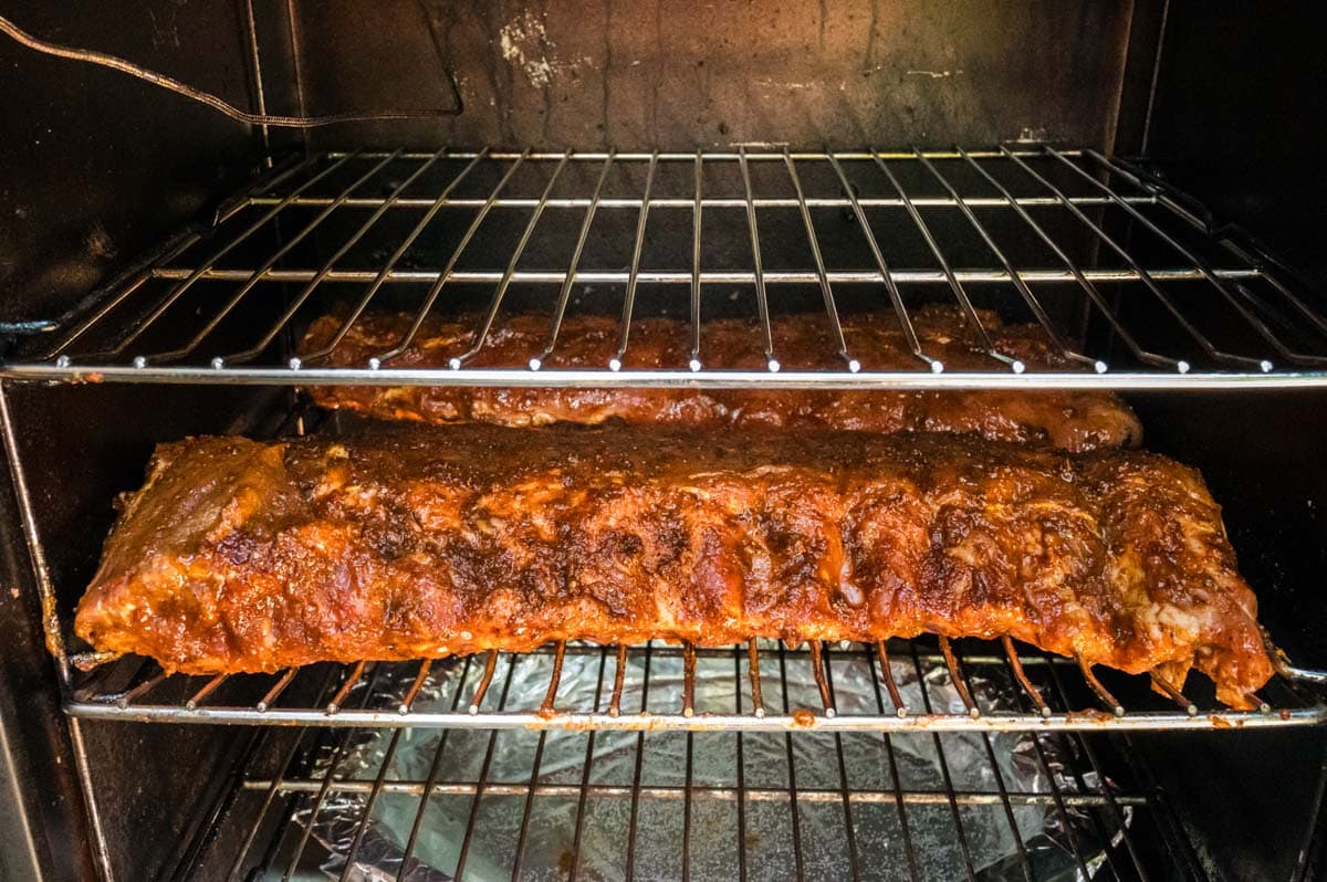 Ribs in the smoker with rub on the for the first 3 hour smoke.