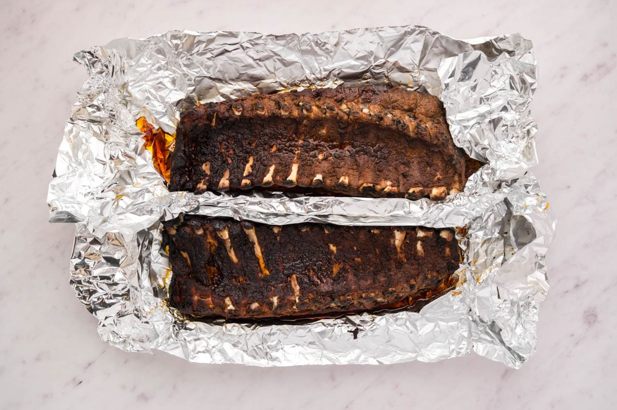 Unwrapped foil showing ribs after cooking in foil.